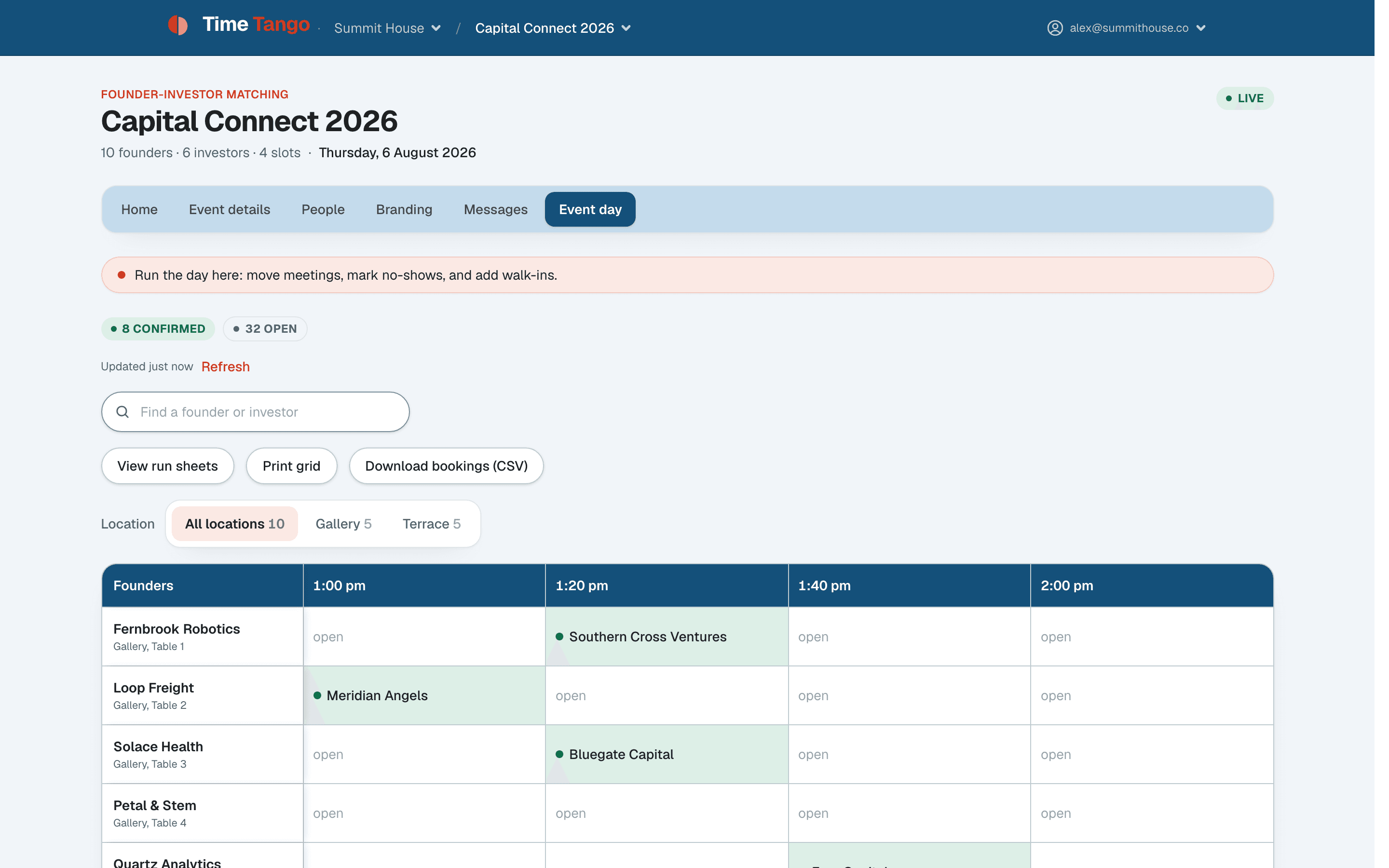 The live meeting grid: founders down the side, time slots across, confirmed meetings filling in